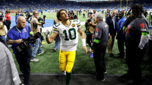 Packers' Love tames the Lions, Cowboys and 49ers march on