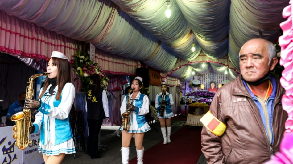 All-women marching band livens up Taiwanese funerals