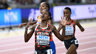 Kenya's Faith Kipyegon wins world 5,000m for historic double