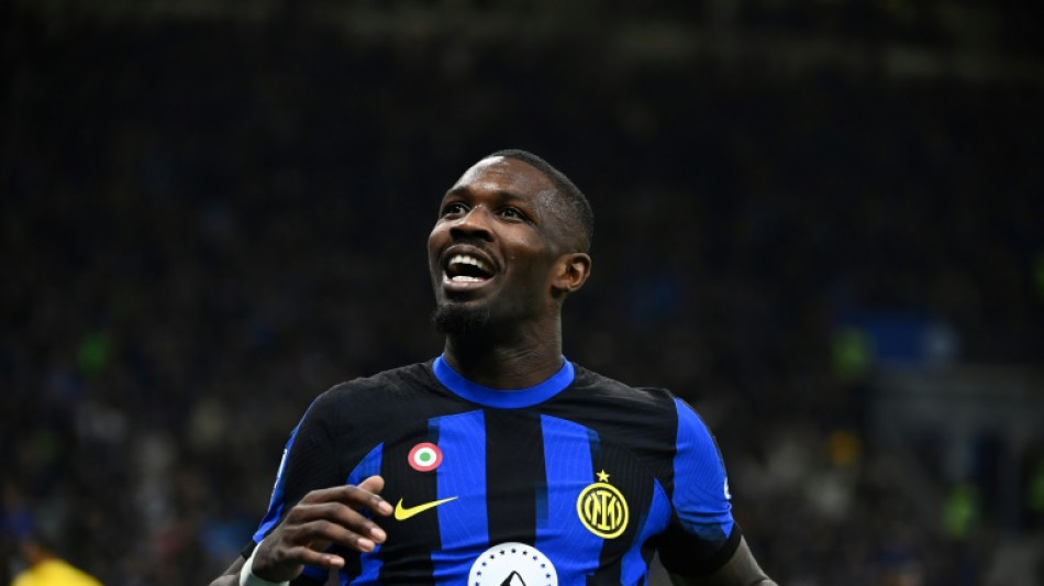 Thuram gives leaders Inter revenge on Lukaku as Napoli draw with Milan