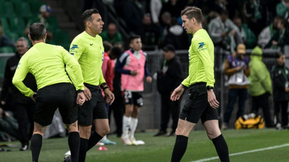 Linesman hit by projectile as Saint-Etienne edge toward safety