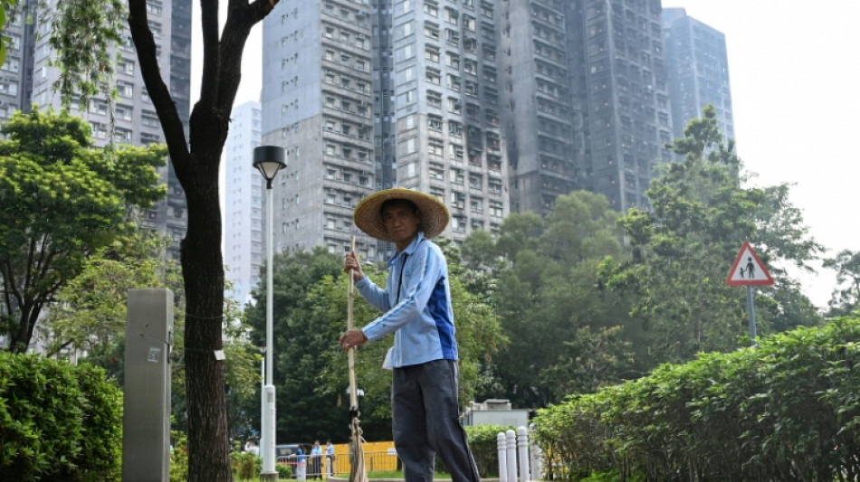 Hong Kong: des habitants retrouvent leur logement apr&egrave;s l'incendie qui a fait 168 morts