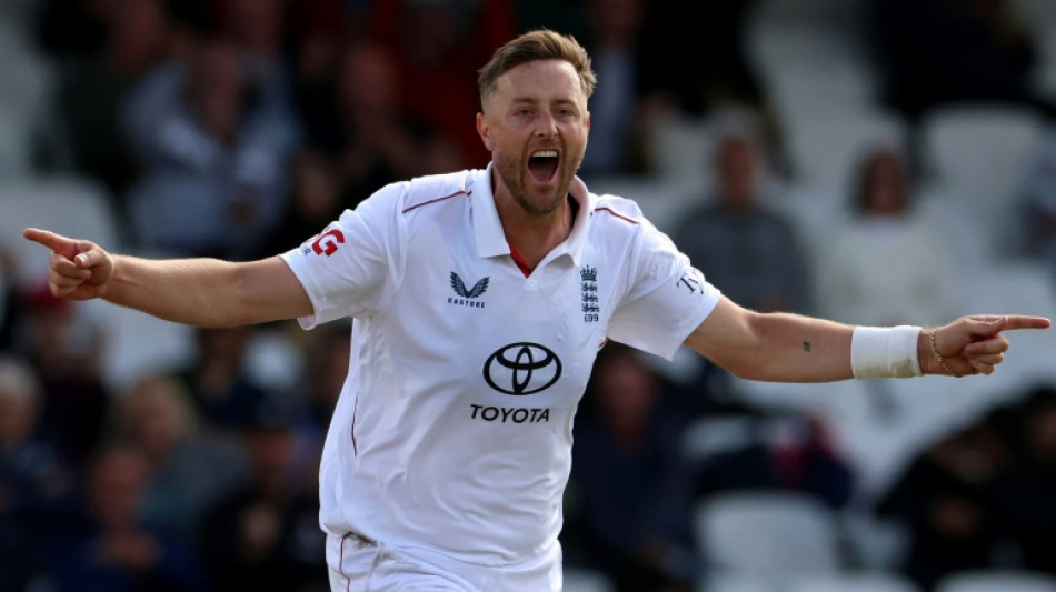 Robinson and Tongue share match ball after dismissing Pakistan 